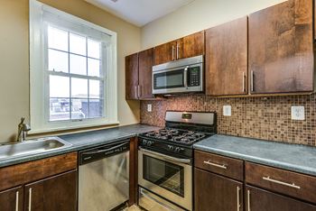 Renovated kitchen with stainless steel appliances at 1630 Park, Washington, DC, 20010